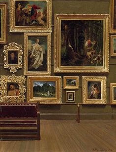 there are many paintings on the wall and one is sitting next to a wooden bench