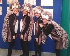 three girls dressed in animal costumes posing for the camera