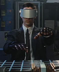 a man in a suit and tie holding out his hand with a virtual headset on