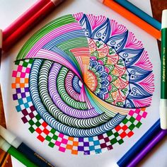 an art project with colored pencils and markers