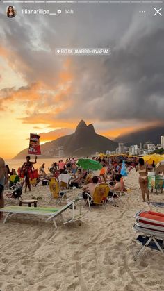 many people are on the beach at sunset with umbrellas and chairs in the foreground