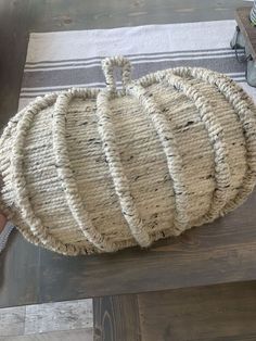 a large round rug sitting on top of a wooden table