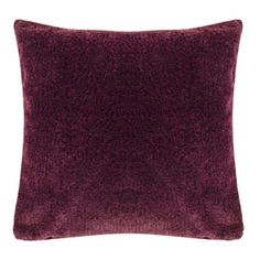 a dark red pillow on a white background