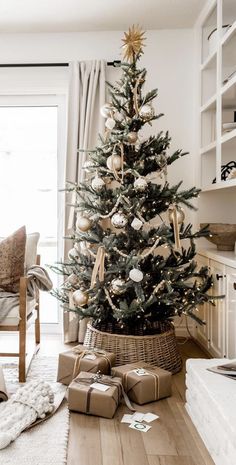 a small christmas tree with presents under it