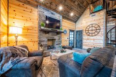 a living room filled with furniture and a flat screen tv mounted on the wall above a fire place