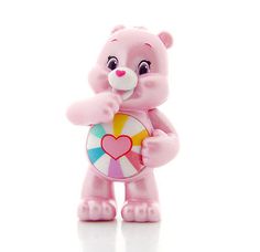 a pink teddy bear holding a lollipop candy ball in it's right hand