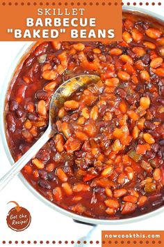 a skillet filled with baked beans on top of a table