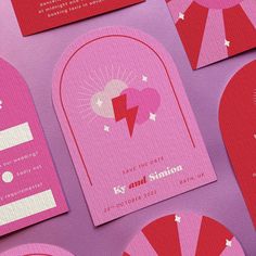 pink and red wedding stationery with fan shaped designs on the front, back and sides