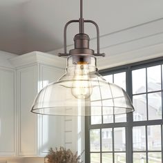 a light fixture hanging from the ceiling in a kitchen