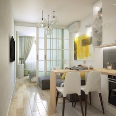 a dining room and kitchen area in a modern style home with wood flooring, white walls and tile floors