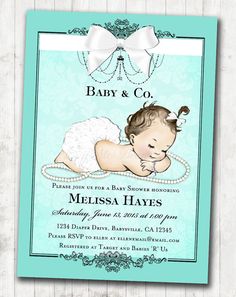 a baby is laying on its back with pearls in it's diaper and the words, baby & co