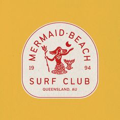 the mermaid - beach surf club logo is shown in red and white on a yellow background