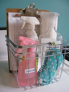 a metal basket with cleaning products in it