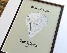 a white frame with a black border holding a map and the words best friends written on it