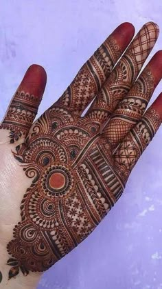 the hand is decorated with intricate designs