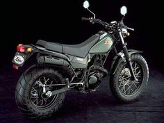 a motorcycle parked in front of a black background