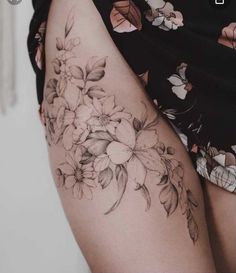 a woman's thigh with flowers on it