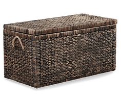 a large woven storage box with handles and rope around the lid, on an isolated white background