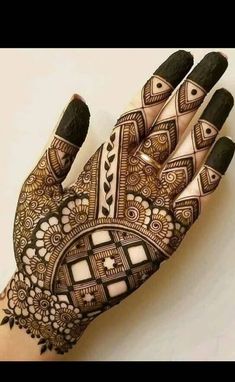 the hand is decorated with intricate designs