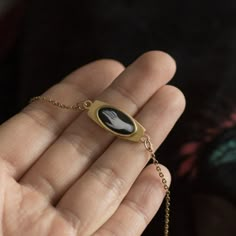 Victorian  gothic hand bracelet. Vintage witchy or mourning bracelet style. The base of the bracelet is made of brass, chain made of stainless steel imitating gold or silver. The illustration is covered with a thick layer of epoxy resin, which creates a smooth, colorless dome. The oval frame has the following dimensions: 16x9mm Base under the frame: 25x10mm  bracelet size:  Please give me the circumference of your wrist and I will adjust the size of the bracelet. Your size will be increased by 5 Gold Bracelet Antique, Gothic Gold Stainless Steel Jewelry, Gothic Gold Bracelets For Gifts, Gold Gothic Bracelets For Gifts, Gold Gothic Bracelet For Gift, Antique Black Bracelets As Gift, Beautiful Jewelry Vintage, Vintage Gothic Aesthetic, Etsy Aesthetic