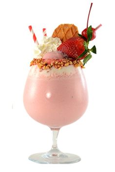 a strawberry milkshake with whipped cream and strawberries