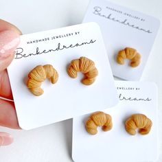 there are three small pieces of food in the shape of croissants on top of each other