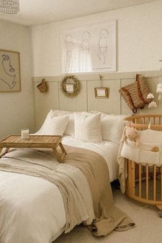 a baby's room is decorated in neutrals and whites