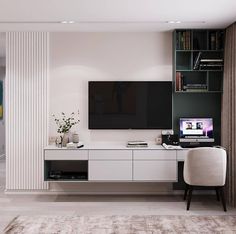 a living room with a large flat screen tv mounted on the wall next to a white chair