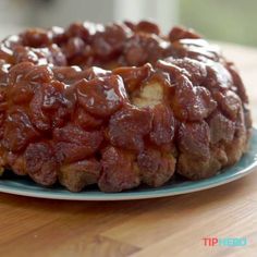 a bundt cake covered in caramel glaze on a plate with the words easy