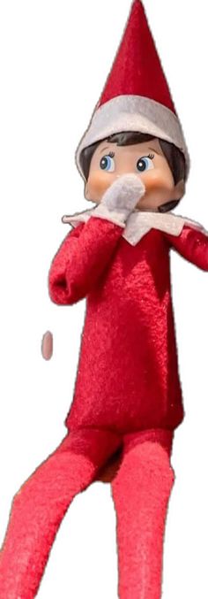 the elf is wearing a red suit and has his hands on his face as if he's holding something in one hand