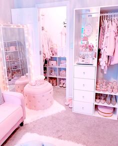 a room filled with lots of white furniture and pink accessories in it's walls