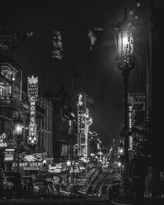 a black and white photo of a city at night