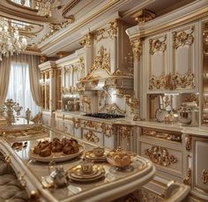 a fancy kitchen with gold and white decor