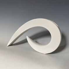 a white sculpture sitting on top of a table