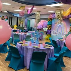 there are balloons and tables in the room