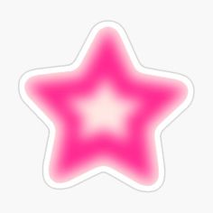 a pink star sticker sitting on top of a white surface with a light reflection