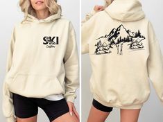 Custom Ski Hoodie, Personalized Winter Sports Sweatshirt, Skiing Shirt, Trendy Snowboard Shirts, Mountain Ski Tee, Gift For Skier, R701 ♥️ WELCOME ♥️ Looking for super soft, comfy, and high-quality clothes for your special days or loved ones? You've come to the right place! We absolutely love what we do and are dedicated to making your shopping experience just perfect. If you have any questions about our products, don't hesitate to reach out. We're here to help and will get back to you as soon as possible! 🔵 HOW TO ORDER  1️⃣Select the t-shirt size 2️⃣ Select the color 3️⃣ If you have, add your personalized designs, enter customization in "Add your personalization" field 4️⃣ Add to cart 5️⃣ Go back and Repeat for each size (to create a set ) ♻️ CARE INSTRUCTIONS  🟢 Wash item inside out i Ski Hoodie Design, Snowboard Shirts, Ski Sweatshirt, Ski Apparel, Ski Shirts, Hoodie Personalized, Sports Sweatshirt, Sports Sweatshirts, Snowboards