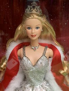 a barbie doll wearing a silver and red dress with a tiara on her head