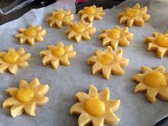 the cookies are decorated with yellow icing