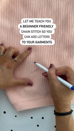 two hands writing on a piece of paper with the words let me teach you a beginner friendly chain stitch so you can add letters to your garments