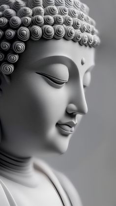 a white buddha statue with its eyes closed