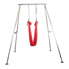 a red hammock hanging from a metal frame