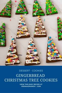 christmas tree cookies are arranged on a white counter top with the words desert cookies written in blue