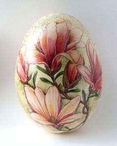 an egg with flowers painted on it