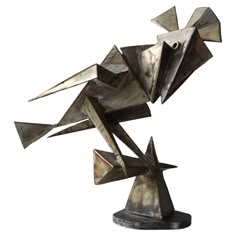 an abstract metal sculpture on a white background