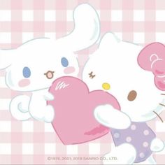 two hello kitty characters holding a heart