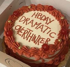 a birthday cake in a box with the words hbday dramatic okrhinker written on it