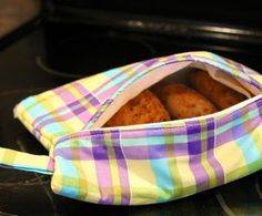 a bag filled with donuts sitting on top of a stove