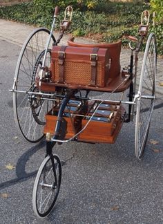 an old fashioned bicycle with luggage strapped to the back