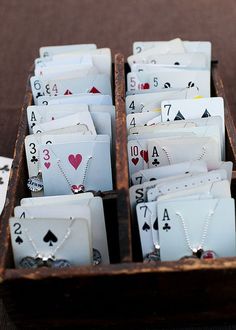 playing cards are arranged in a wooden box